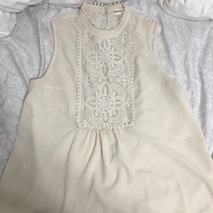 sleeveless tank top; high rise neck